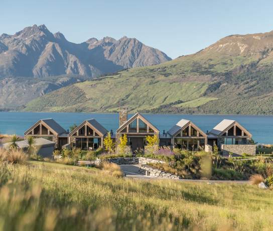 Blanket Bay Villas with mountain and lake backdrop