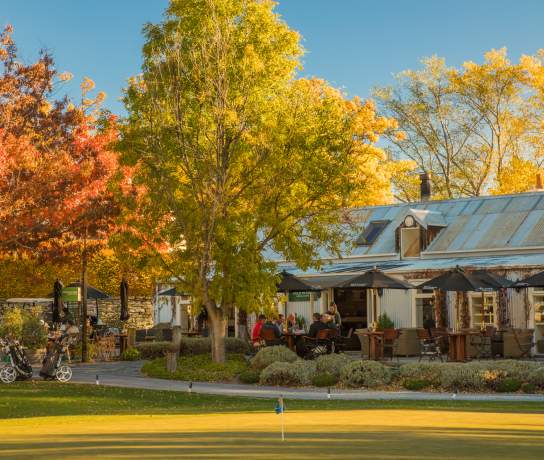 Cafe next to a golf course nestled in among colourful autumn trees