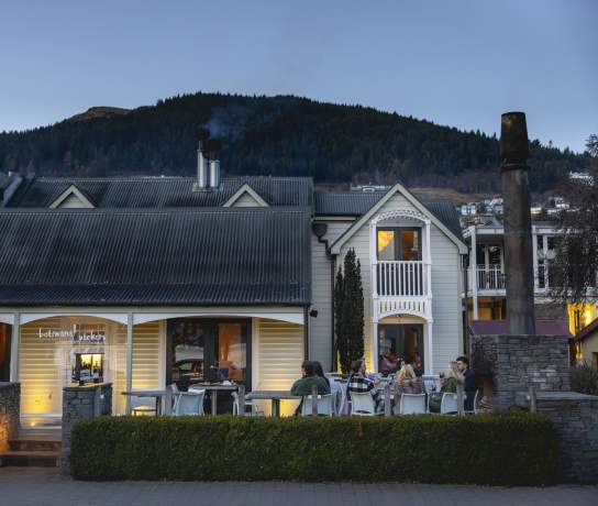 Outside shot of Botswana Butchery Restaurant historic building at dusk