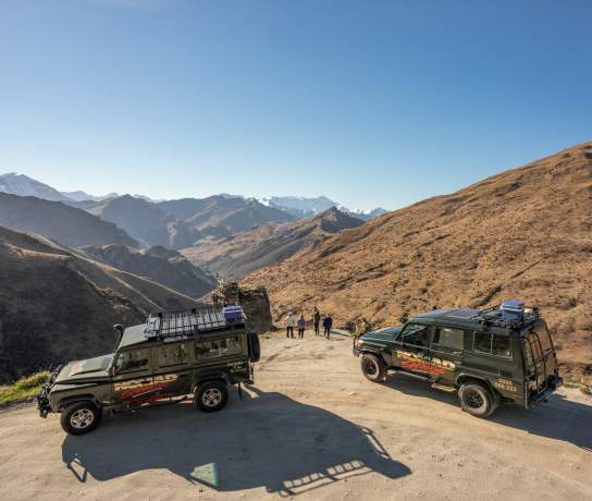 Group with two cars parked at Lighthouse Point on the Skippers Road Queenstown