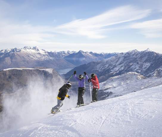 Three Friends Skiing Coronet Peak