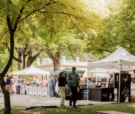 People walking through Arrowtown market