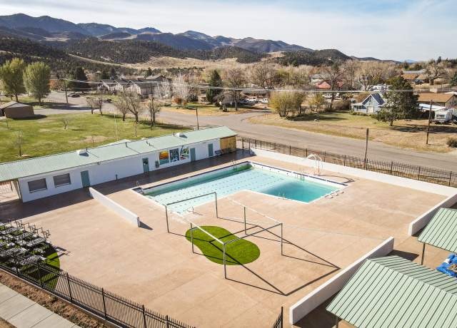 Outdoor community swimming pool with mountain views in Parowan, Utah