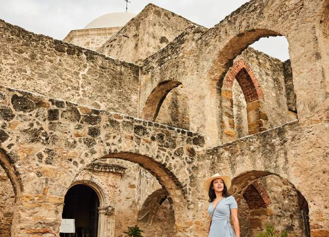 Woman walking through Mission San Jose in San Antonio Missions National Historical Park