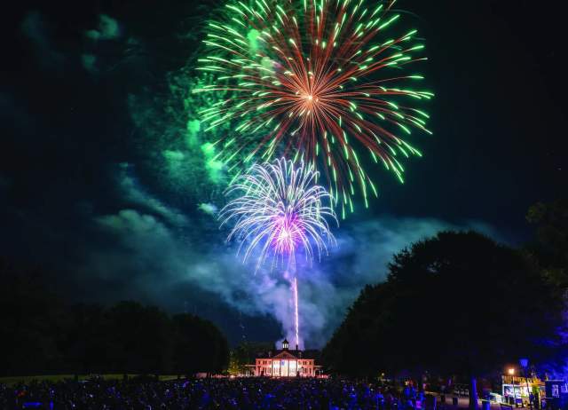 A bright and beautiful fireworks show takes place over the historic buildings of American Village in Montevallo.