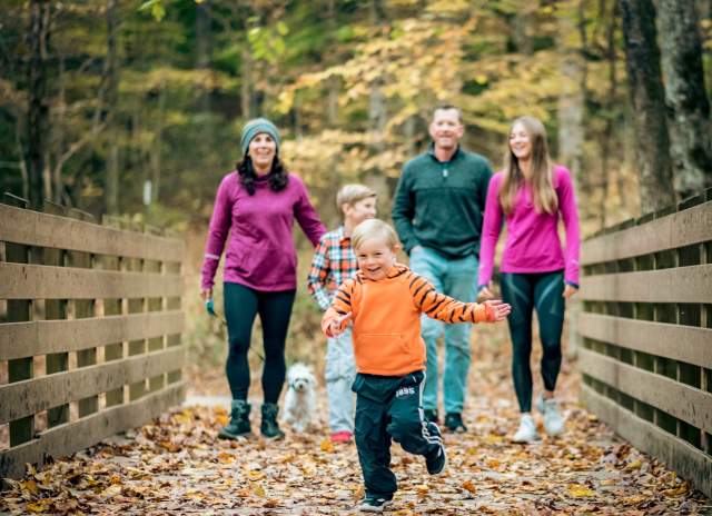 family on a trail in the fall