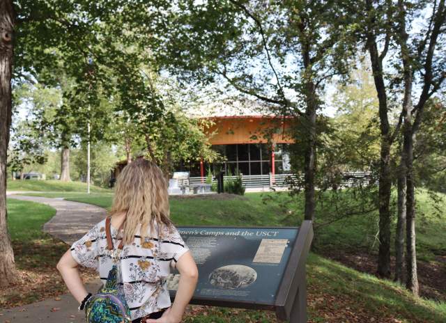 a woman reads about USCT Freedman's Camps