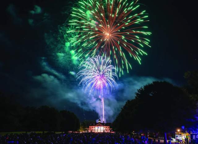 A bright and beautiful fireworks show takes place over the historic buildings of American Village in Montevallo.