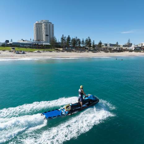 Jack Gibbs on Jet Ski in water near beach