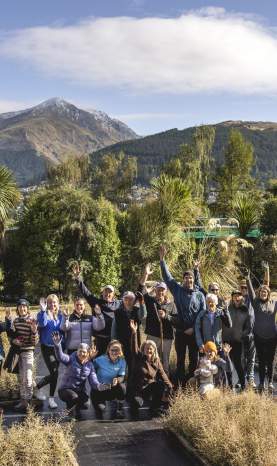 Group of volunteers together posing for a photo at Whakatipu Reforestation Trust nursery