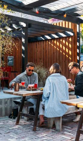 Group of people dining in an outdoor courtyard