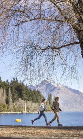 Family enjoying themselves on Queenstown Beach in spring
