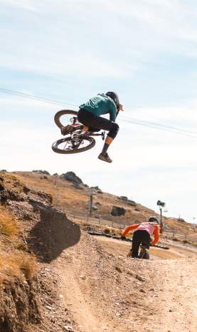 Mountain Biking does a jump at Cardrona Bike Park