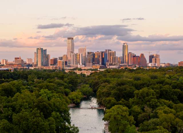 Aerial view of Barton Springs Pool and downtown Austin Texas skyline