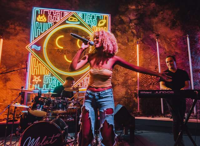 Melat performing at Cheer Up Charlie's