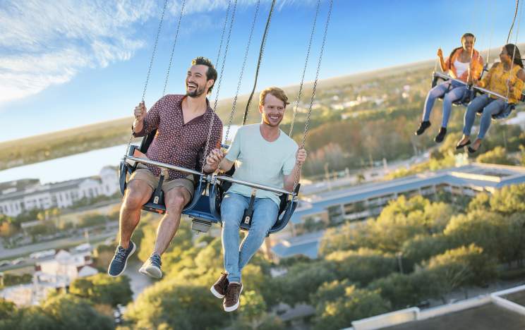 A gay couple riding the Orlando Starflyer at ICON Park