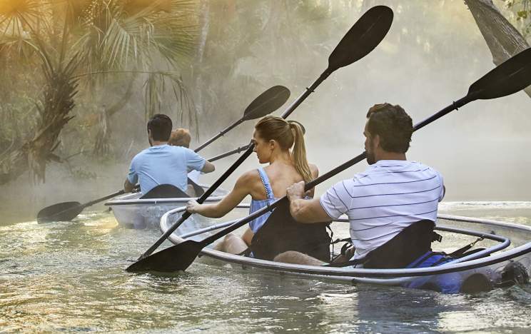 A couple kayaking through King's Landing at Wekiva River