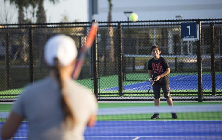 USTA National Campus boy playing at Nemours Family Zone