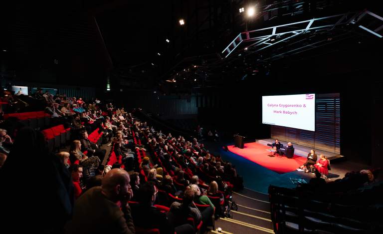 Cultural Tides conference takes place at Hull Truck theatre, an audience watches a panel on stage.