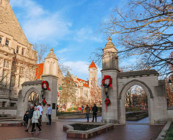 People walking through Sample Gates during a winter day