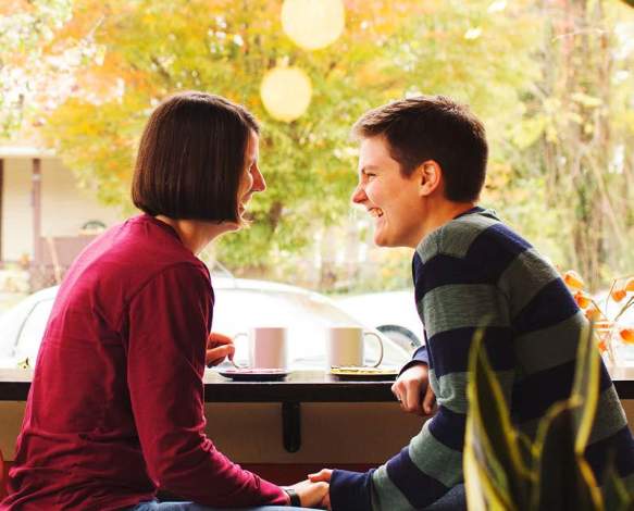 People Sitting With Coffee In Shop Window