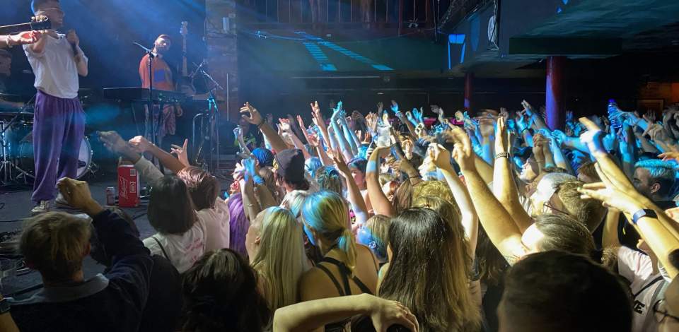 Side view of crowd of people at a music gig at The Brook