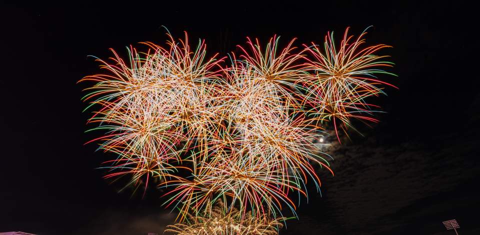 Fireworks in the night sky in front of crowd at Utilita Bowl