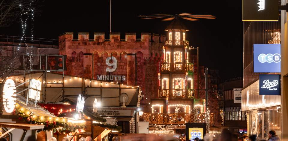 Christmas Market stalls all lit up on Southampton's Above Bar Precinct