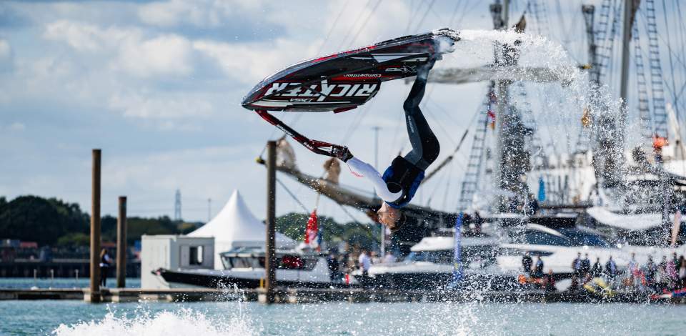 Man doing back flip on a jet ski at Southampton International Boat Show