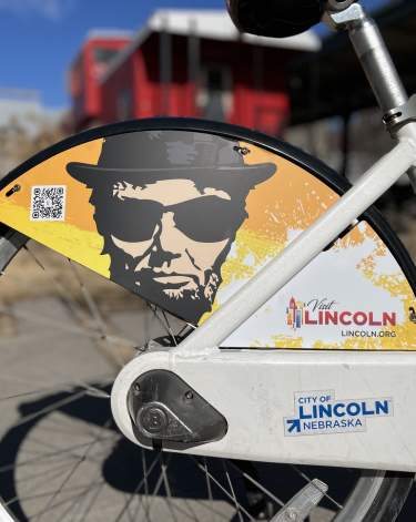 back tire of visit lincoln bike with branding