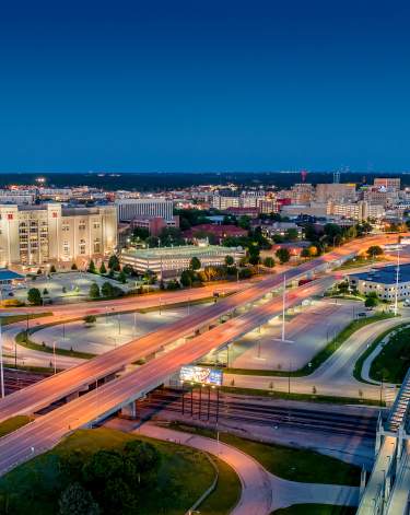 Aerial photo of interchanges and stadium at dusk