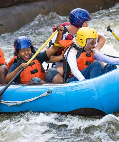 Family in a tube White Water Rafting