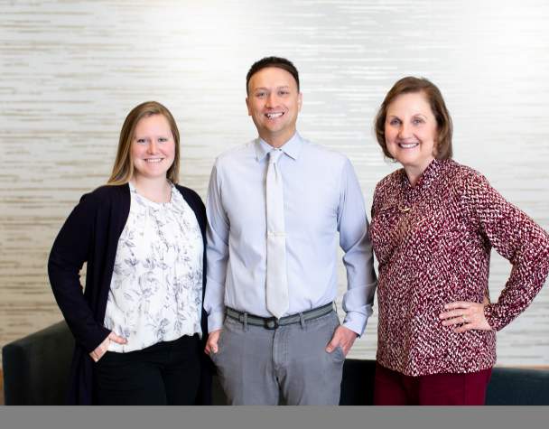 Rapid City Sales team, two women and one man looking at the camera.