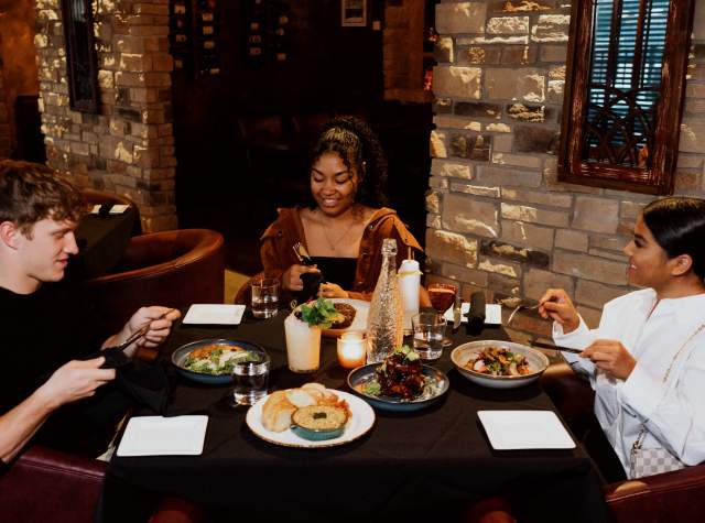 Friends dining at Copper Spoon