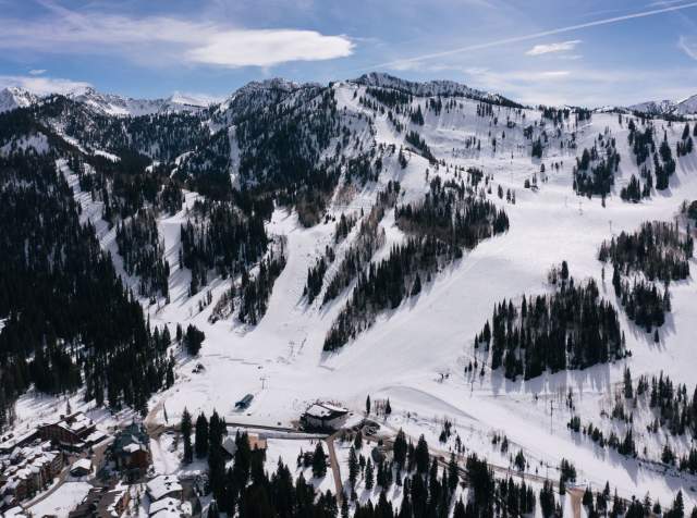 A view of Solitude mountain with snow, showing the trails