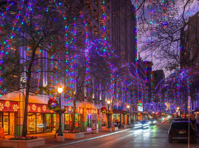 Street in San Antonio adorned with holiday lights and wreaths