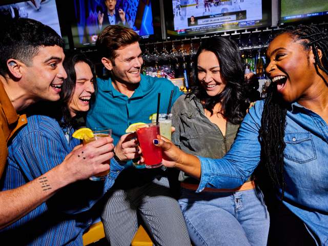 Friends at bar at Topgolf