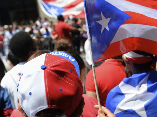 Puerto Rican pride comes in red white and blue at a PR day parade.