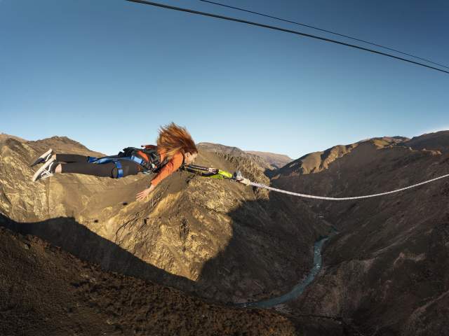 Woman flying through the air on the Nevis Catapult