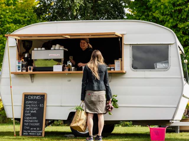 Person ordering coffee at Remarkables Market