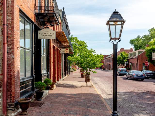 The road, sidewalks, and buildings are all made of brick in Historic Main Street in St. Charles, MO