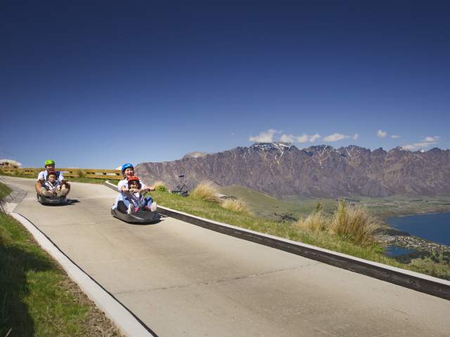 Family on a luge ride at Skyline Gondola Queenstown
