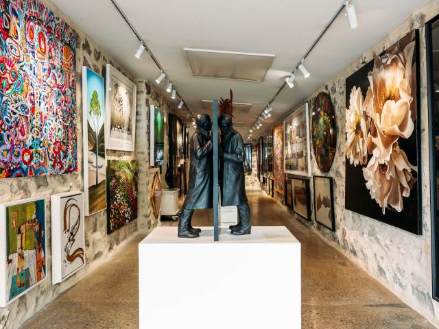 Interior shot with eclectic art at Art Bay Gallery