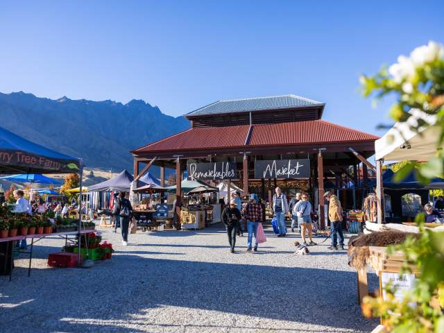 A landscape shot of the iconic Remarkables Market Red Barn on a Saturday morning