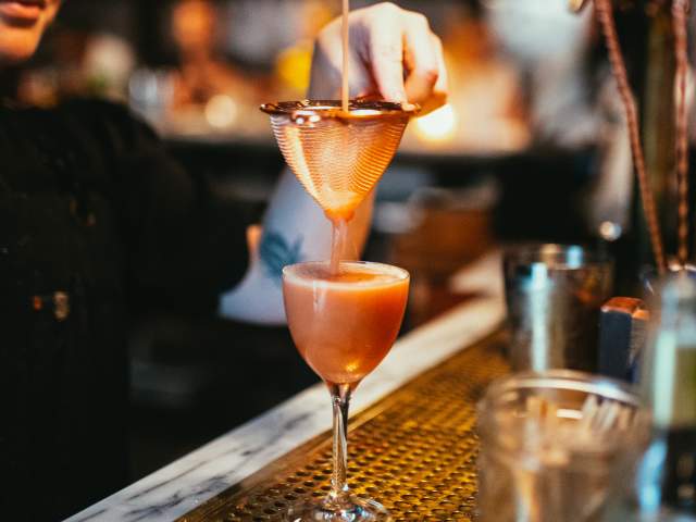 The Courtesy Bar interior bartender