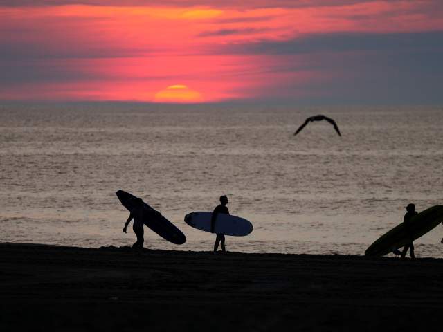 Surfing at Sunrise in Ocean City, MD