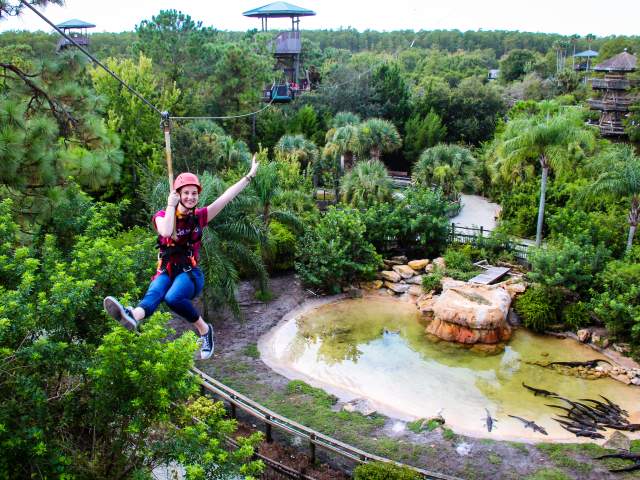 Visit Orlando employee at Gatorland zipline adventure