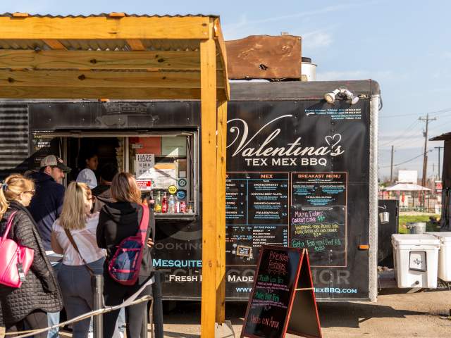 People wait in line at Valentinas Tex Mex BBQ Food Truck in Austin Texas