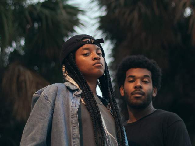 Two members of Magna Carda pose and look at camera