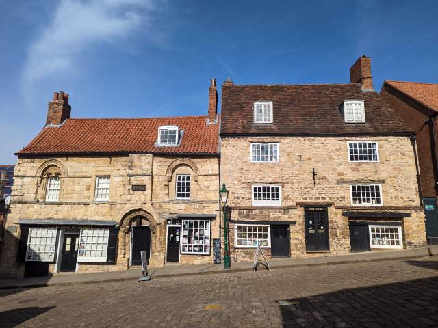 Exterior of Jew's House on Steep Hill in Lincoln with blue sky